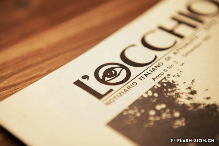 Le logo de L’Occhio, dessiné par l’artiste Mario Tapia, peintre chilien établi à Milan © Pentamedia, Archives de la Ville de Sion, 2019